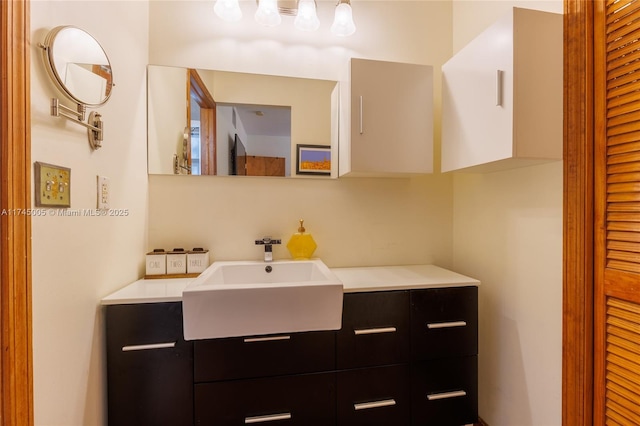 bathroom featuring a closet and vanity