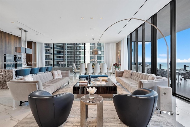 living area with a wall of windows, wooden walls, and marble finish floor