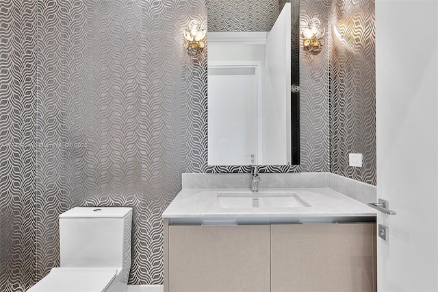 bathroom with vanity and toilet