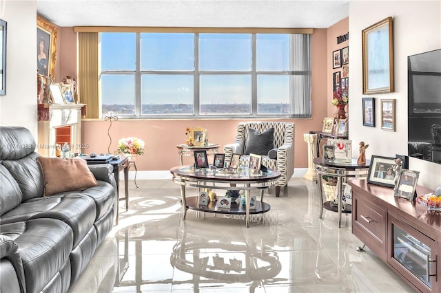 living room with a healthy amount of sunlight and a textured ceiling