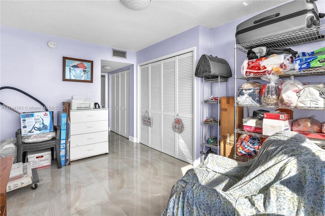 bedroom featuring a textured ceiling