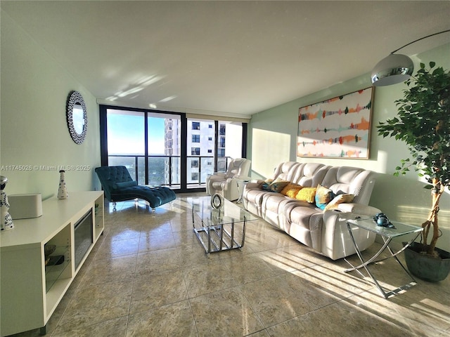 tiled living room featuring floor to ceiling windows