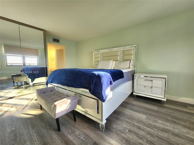 bedroom featuring dark hardwood / wood-style floors