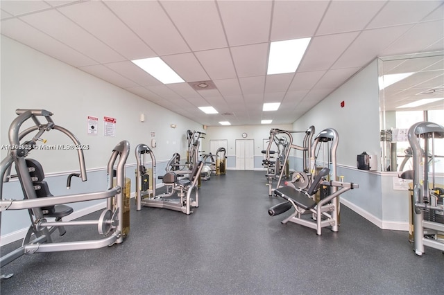 exercise room with a paneled ceiling