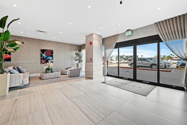 building lobby featuring visible vents