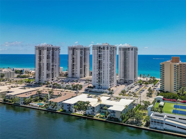 drone / aerial view featuring a water view and a view of city