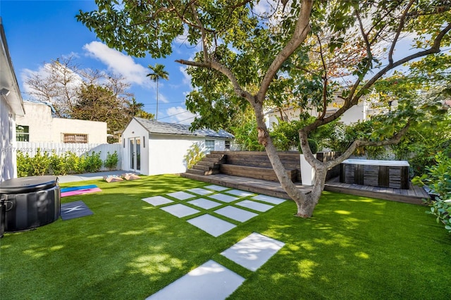 view of yard with a pool, an outdoor structure, and a patio