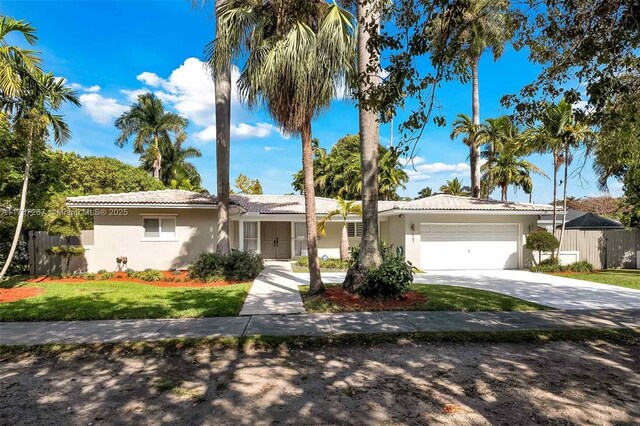 461 NE 115th St, Miami, FL 33161 - single story home featuring stucco siding, a garage, and concrete driveway