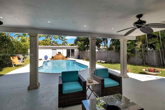 461 NE 115th St, Miami, FL 33161 - view of swimming pool with ceiling fan, a fenced backyard, and a patio area