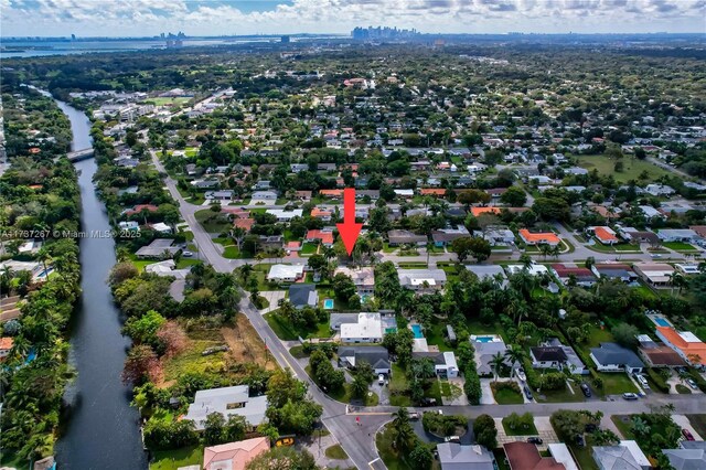461 NE 115th St, Miami, FL 33161 - aerial view of property and surrounding area with a large body of water and nearby suburban area