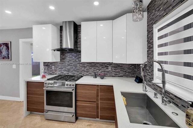 461 NE 115th St, Miami, FL 33161 - kitchen featuring wall chimney exhaust hood, gas range, modern cabinets, a sink, and white cabinetry