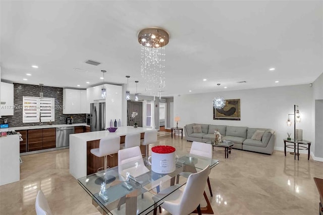 dining area featuring a chandelier