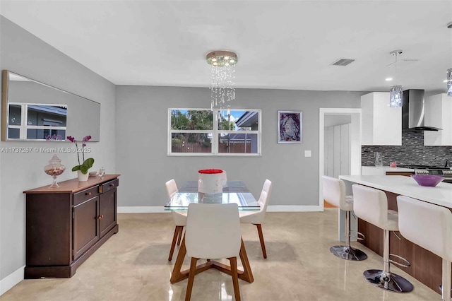 dining area with a notable chandelier