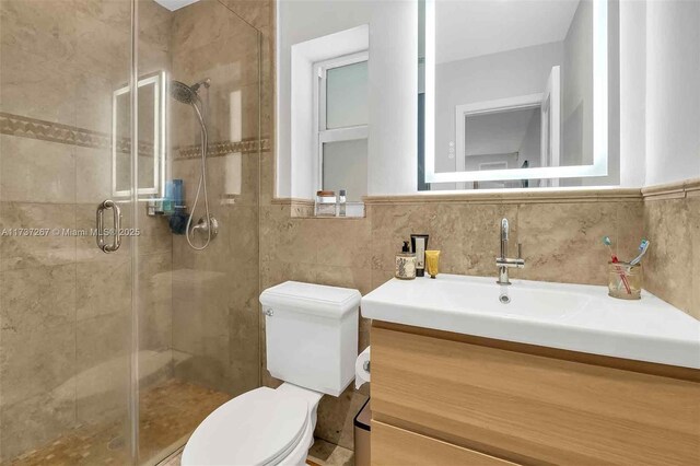 461 NE 115th St, Miami, FL 33161 - full bath with a stall shower, toilet, and vanity