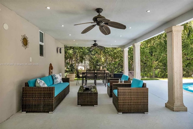 view of patio with ceiling fan and an outdoor living space