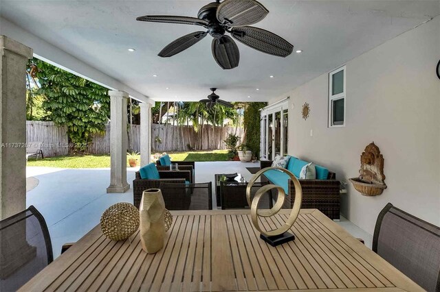 461 NE 115th St, Miami, FL 33161 - fenced backyard with outdoor dining area, french doors, a ceiling fan, and outdoor lounge area