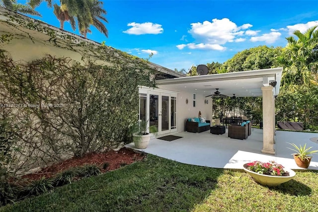 back of house with a patio, an outdoor hangout area, ceiling fan, and french doors