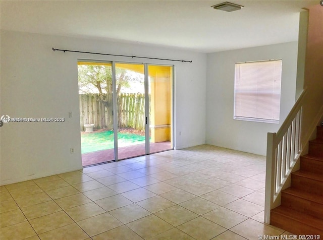 spare room with light tile patterned floors