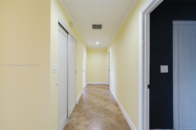 hallway featuring crown molding