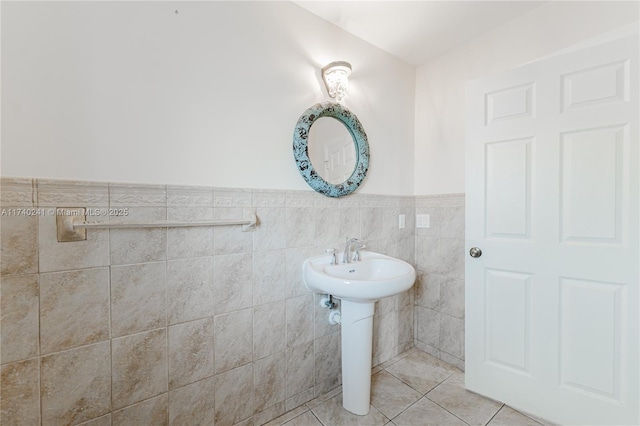 bathroom featuring tile walls, sink, and tile patterned floors