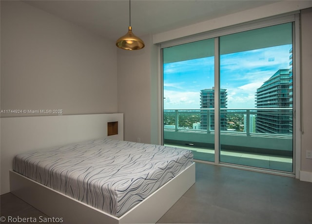 bedroom featuring concrete flooring