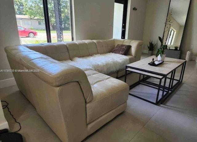 living room with light tile patterned floors