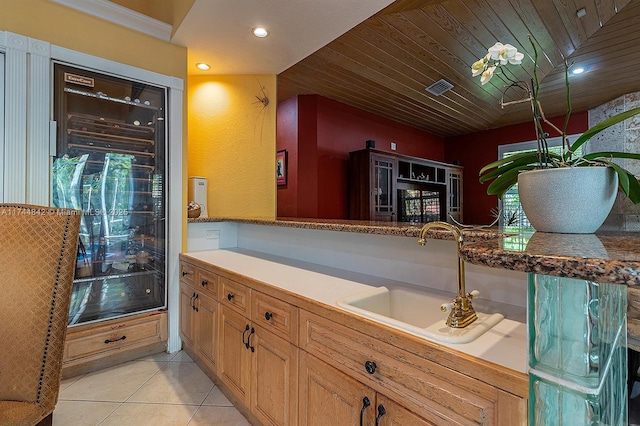 interior space with visible vents, a sink, recessed lighting, light tile patterned flooring, and wooden ceiling