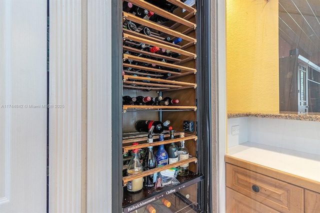 wine cellar featuring wine cooler