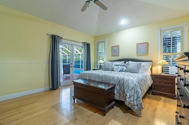 bedroom with french doors, light wood finished floors, baseboards, access to exterior, and vaulted ceiling