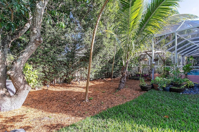 view of yard with a lanai