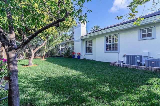 view of yard featuring central AC