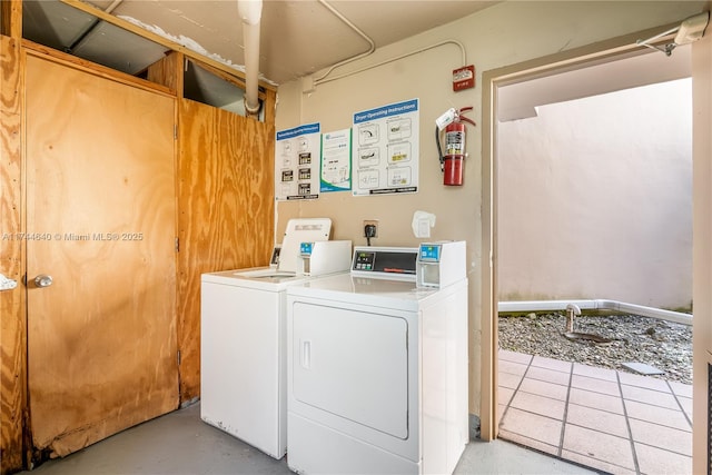 clothes washing area with washer and dryer