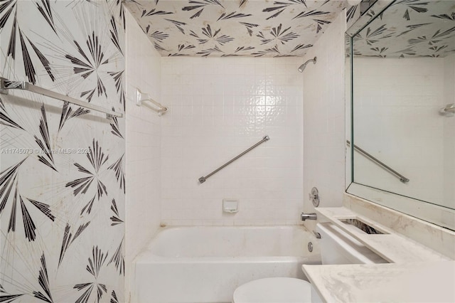 bathroom featuring  shower combination, vanity, and toilet