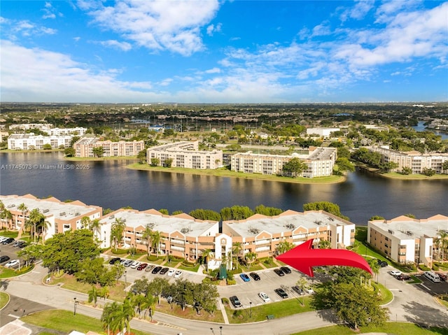 bird's eye view featuring a residential view and a water view