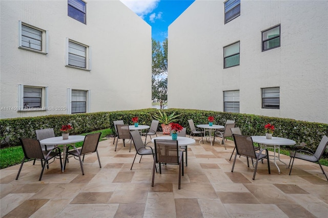 view of patio featuring outdoor dining area