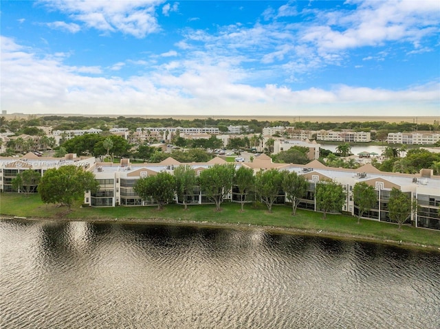 drone / aerial view featuring a residential view and a water view