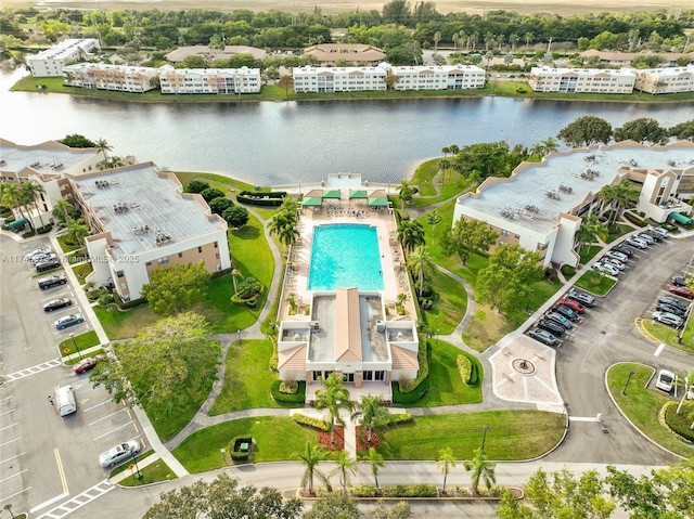 birds eye view of property featuring a water view