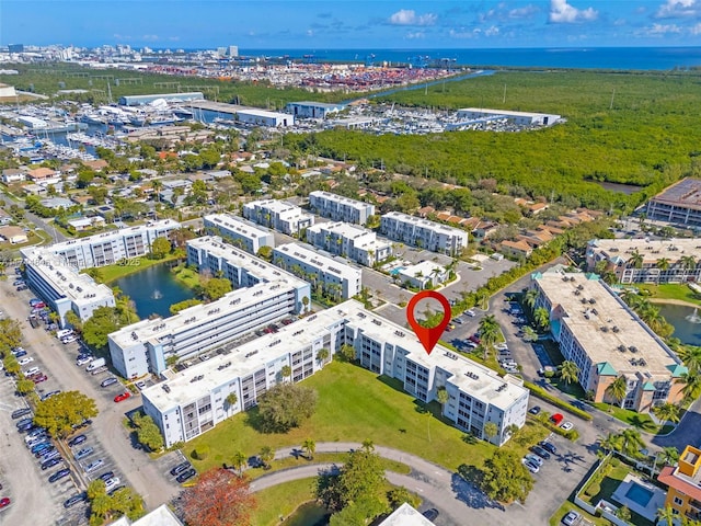 birds eye view of property featuring a water view