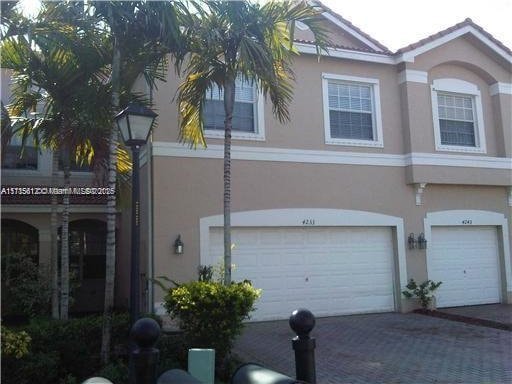 view of side of property with a garage