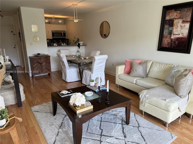 living room with light hardwood / wood-style floors