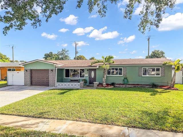 ranch-style home with a garage and a front lawn