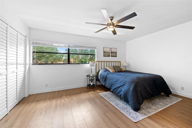 3005 NW 48th Ave Unit 3005, Coconut Creek, FL 33063 - bedroom with wood finished floors, baseboards, and a ceiling fan