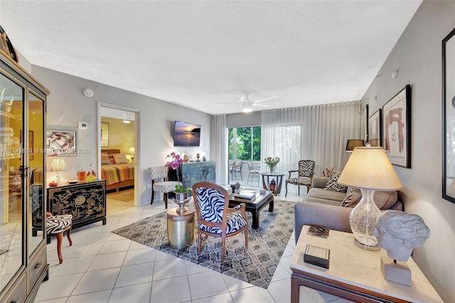 tiled living room with ceiling fan