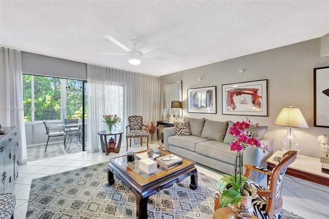 tiled living room featuring ceiling fan