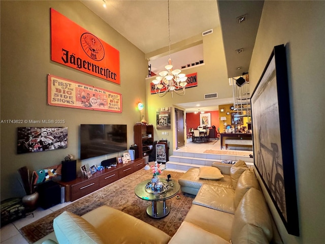3007 NE 183rd Ln Unit 7, Aventura, FL 33160 - tiled living area with a towering ceiling, a chandelier, and visible vents