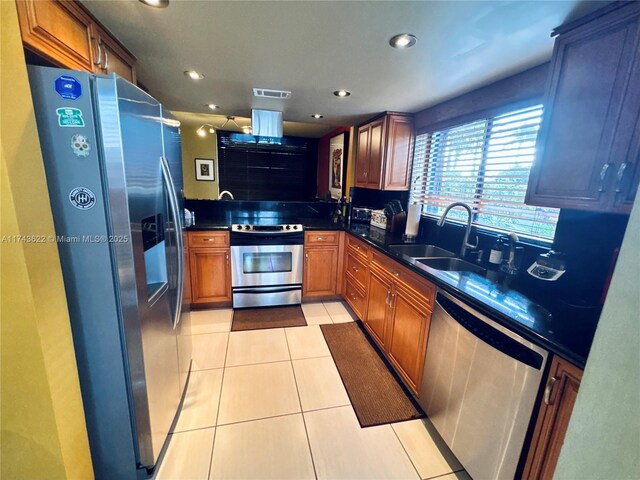 3007 NE 183rd Ln Unit 7, Aventura, FL 33160 - kitchen with a sink, dark countertops, stainless steel appliances, and visible vents