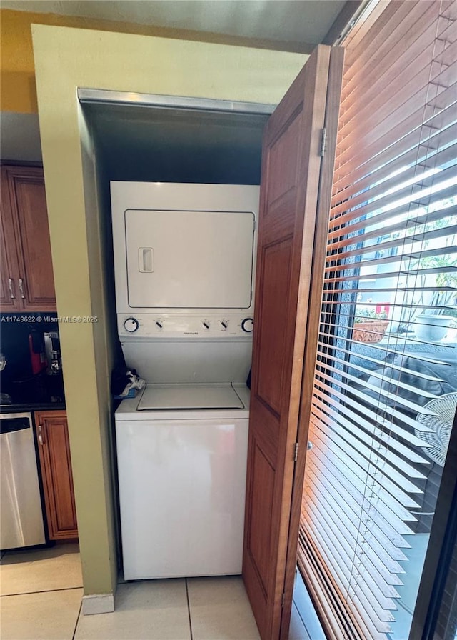 3007 NE 183rd Ln Unit 7, Aventura, FL 33160 - clothes washing area featuring laundry area, light tile patterned floors, and stacked washer / dryer