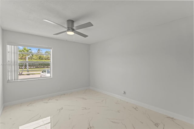 spare room with a textured ceiling and ceiling fan