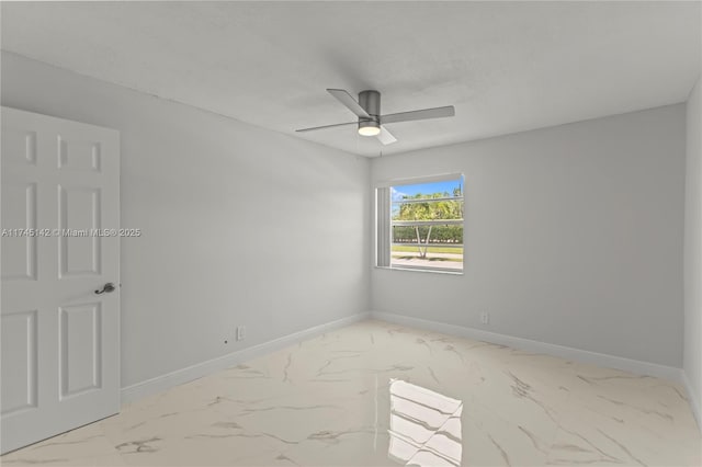 spare room with ceiling fan