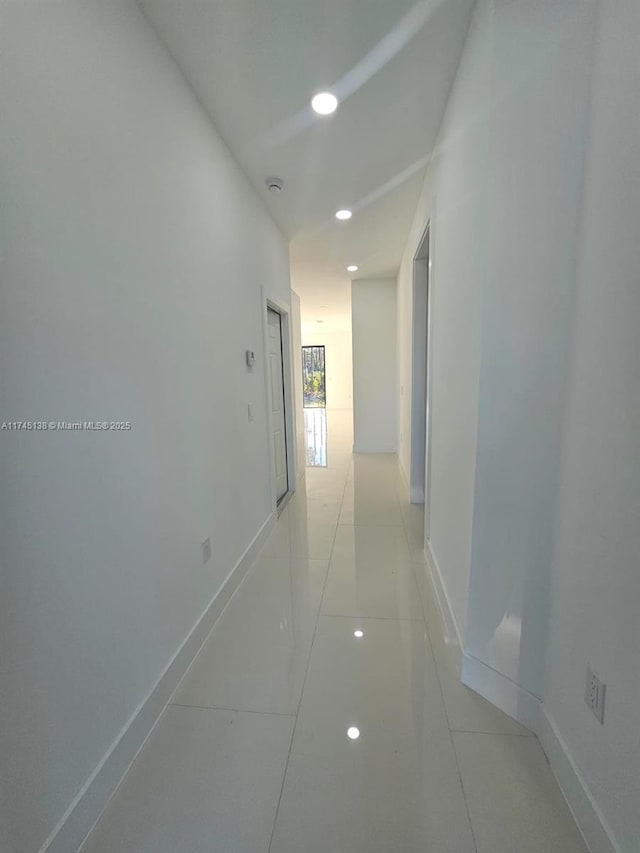 hallway with light tile patterned floors